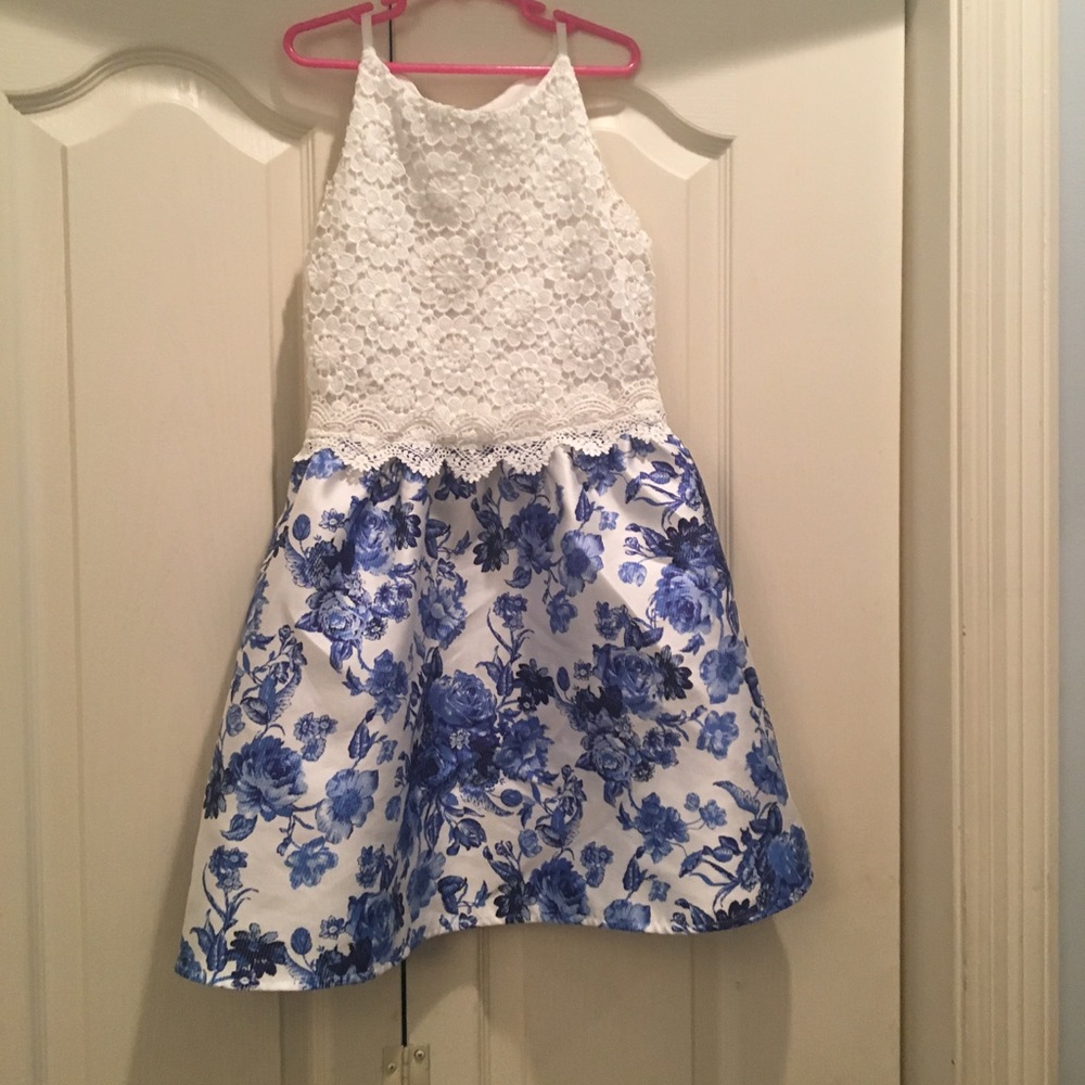 White dress with blue flowers.
